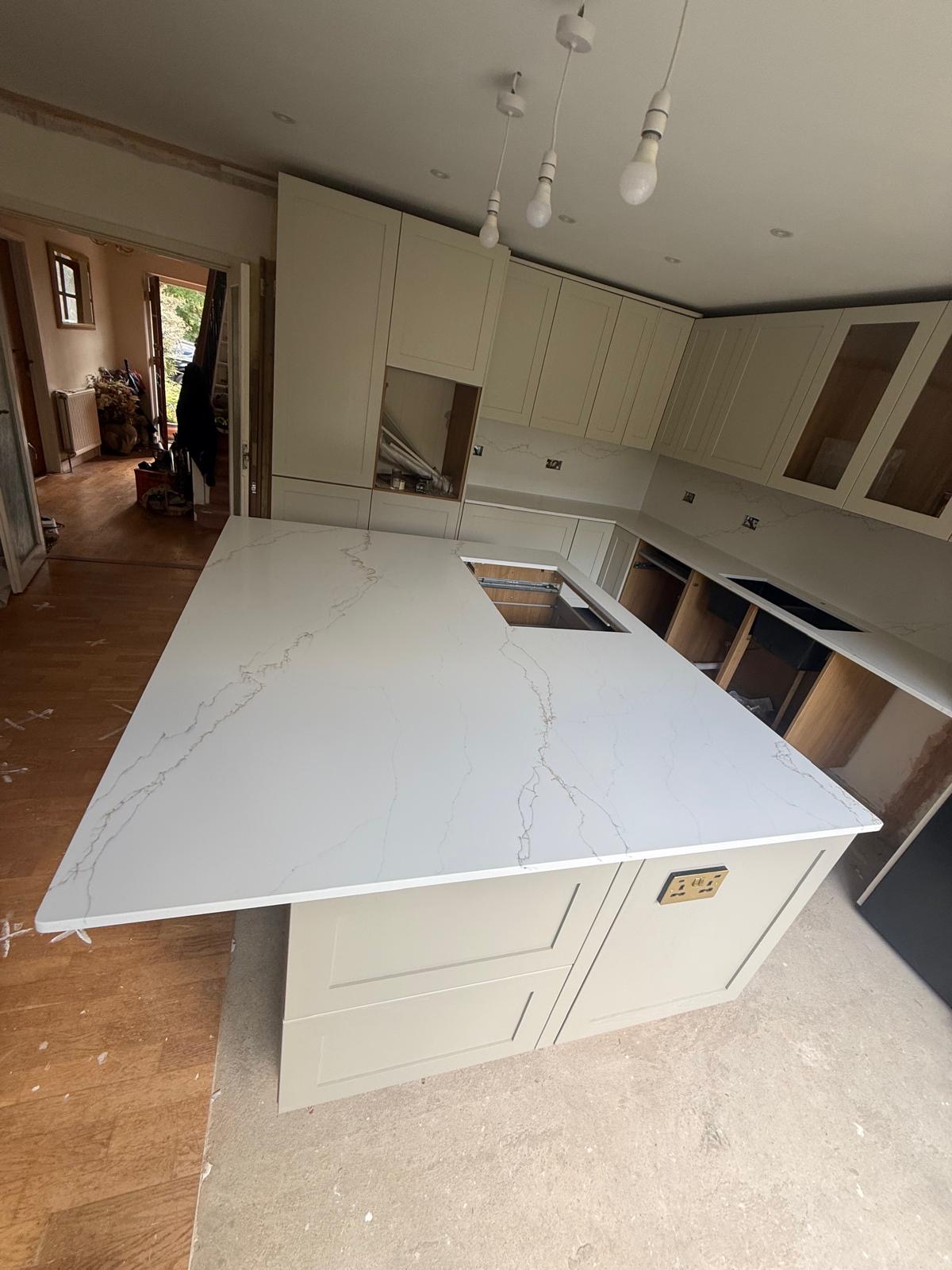 Calacatta quartz island and worktops in cream shaker kitchen